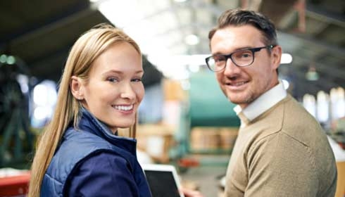 Cropped shot of a two coworkers managing a warehouse