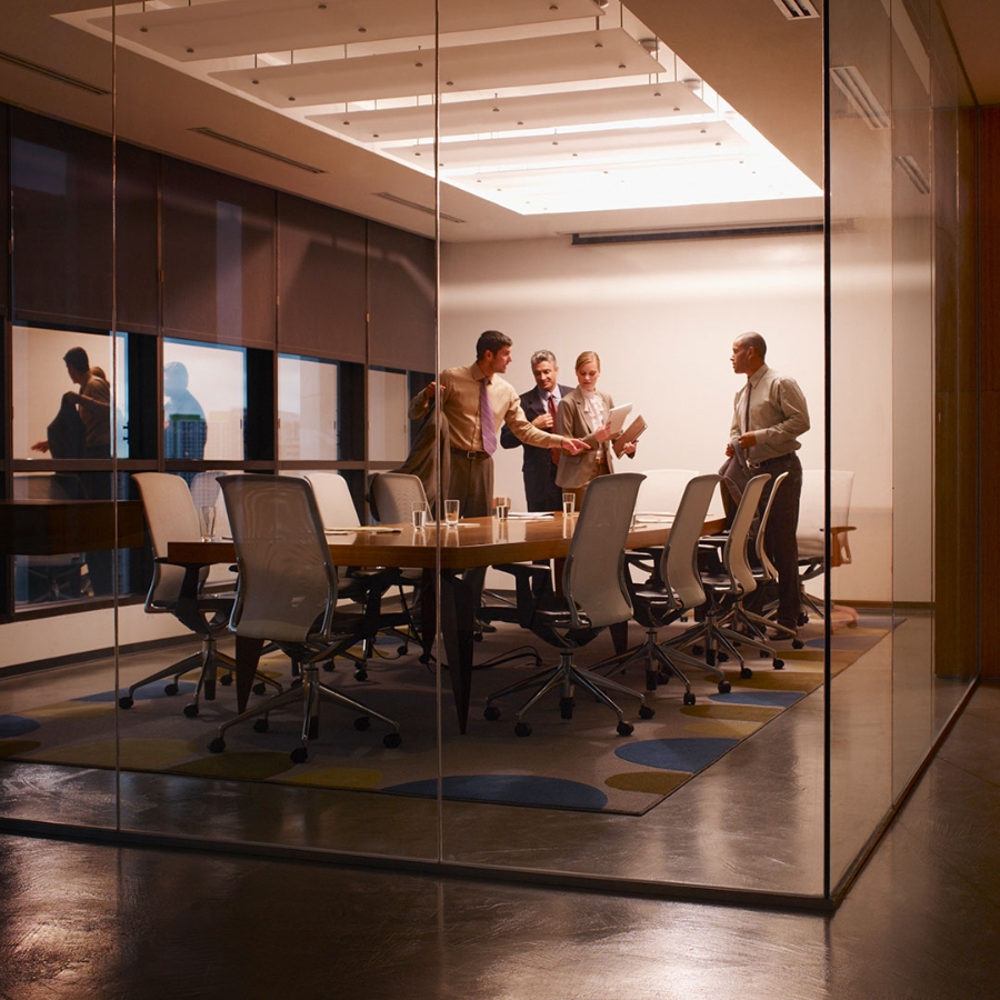 A group of employees in a meeting room
