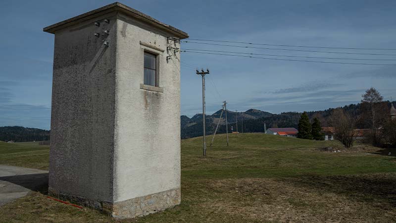 A white tower in a grassy field