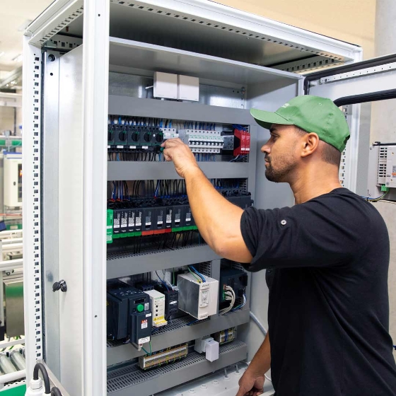 Man with hat in front of product 