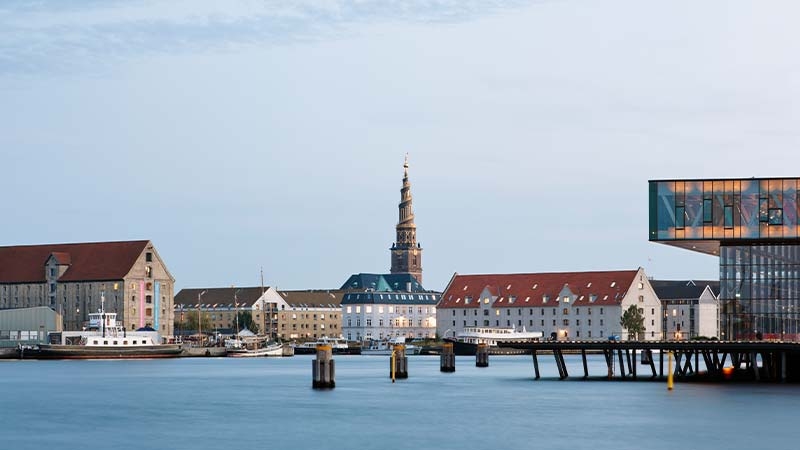 A city with a tower and a body of water
