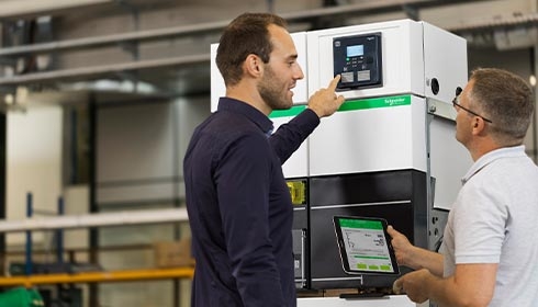 A person pointing at a machine