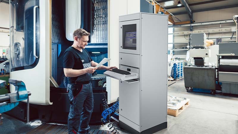 A person standing next to a machine