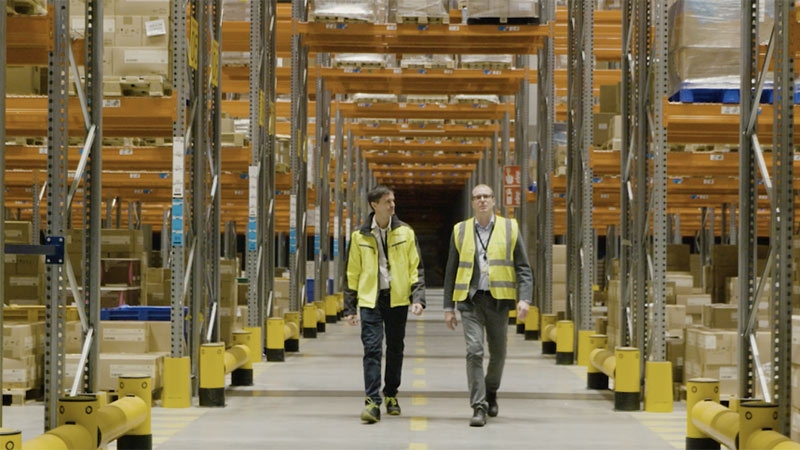 Two Engineer walking in factory