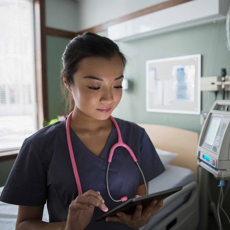 A nurse using her digital tablet