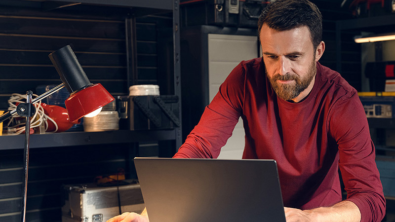 men is working on laptop