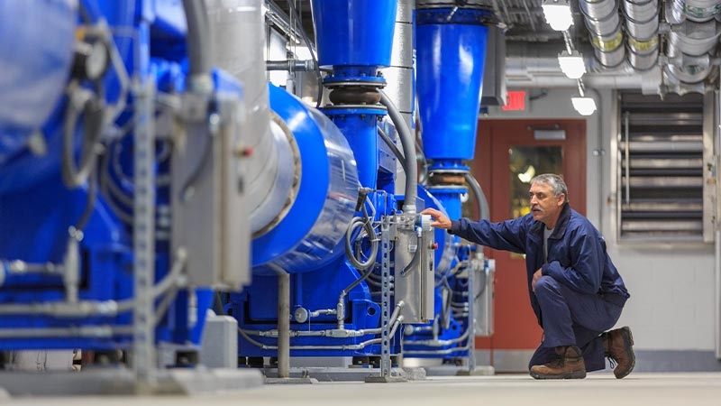 A person touching a machine