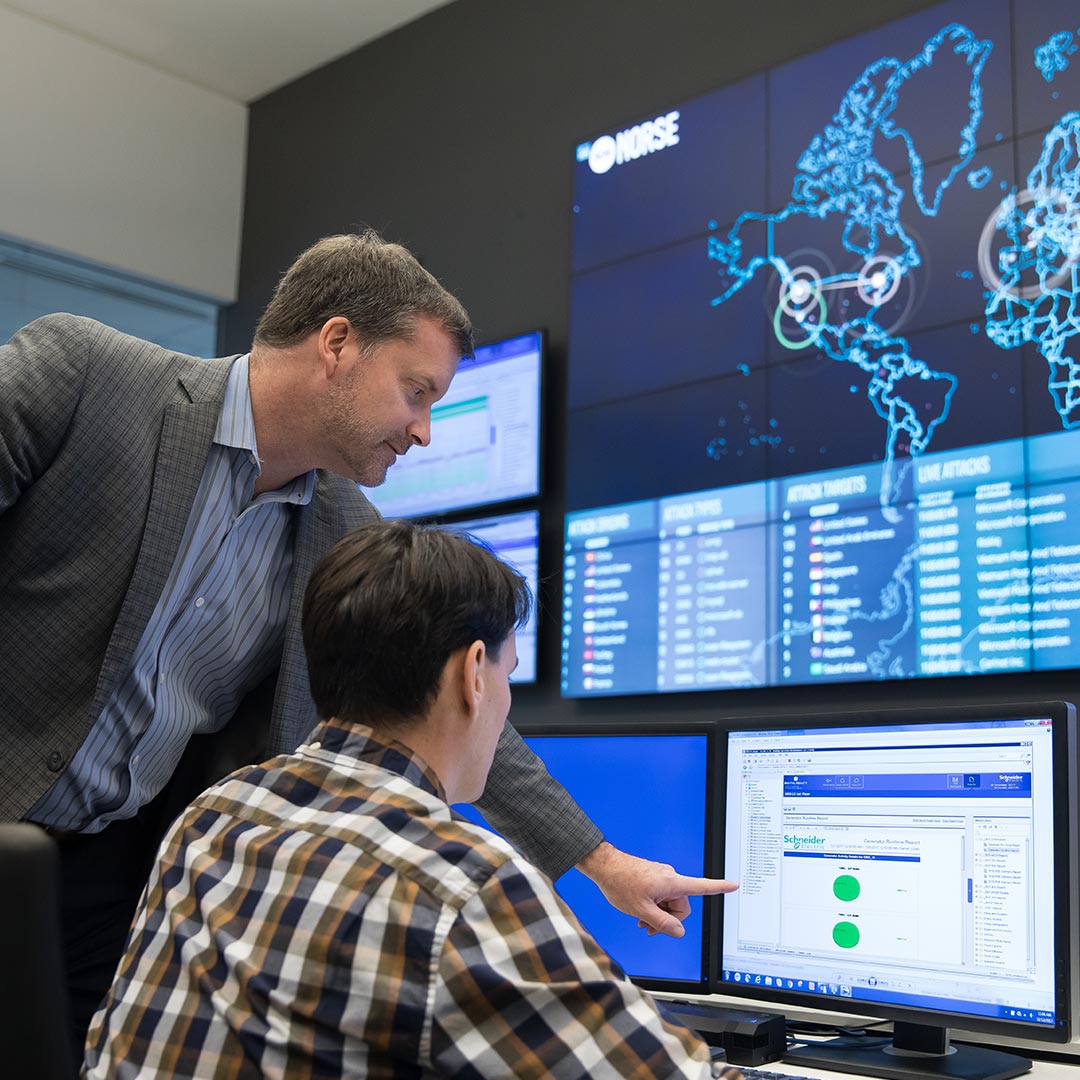Two people in digital data center