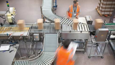 Workers managing the conveyor belt in a packaging facility, industrial automation, machine control, original equipment manufacturer.