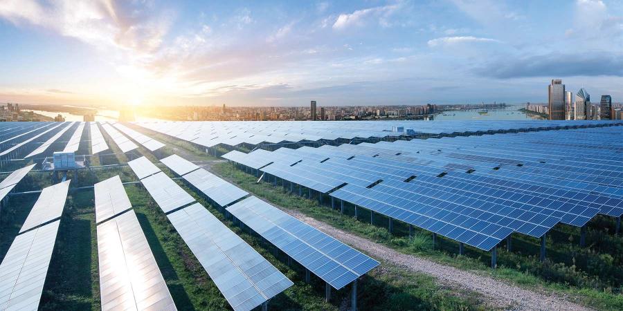Eco-environmentally friendly green energy of sustainable development of solar power plant with Shanghai skyline.
