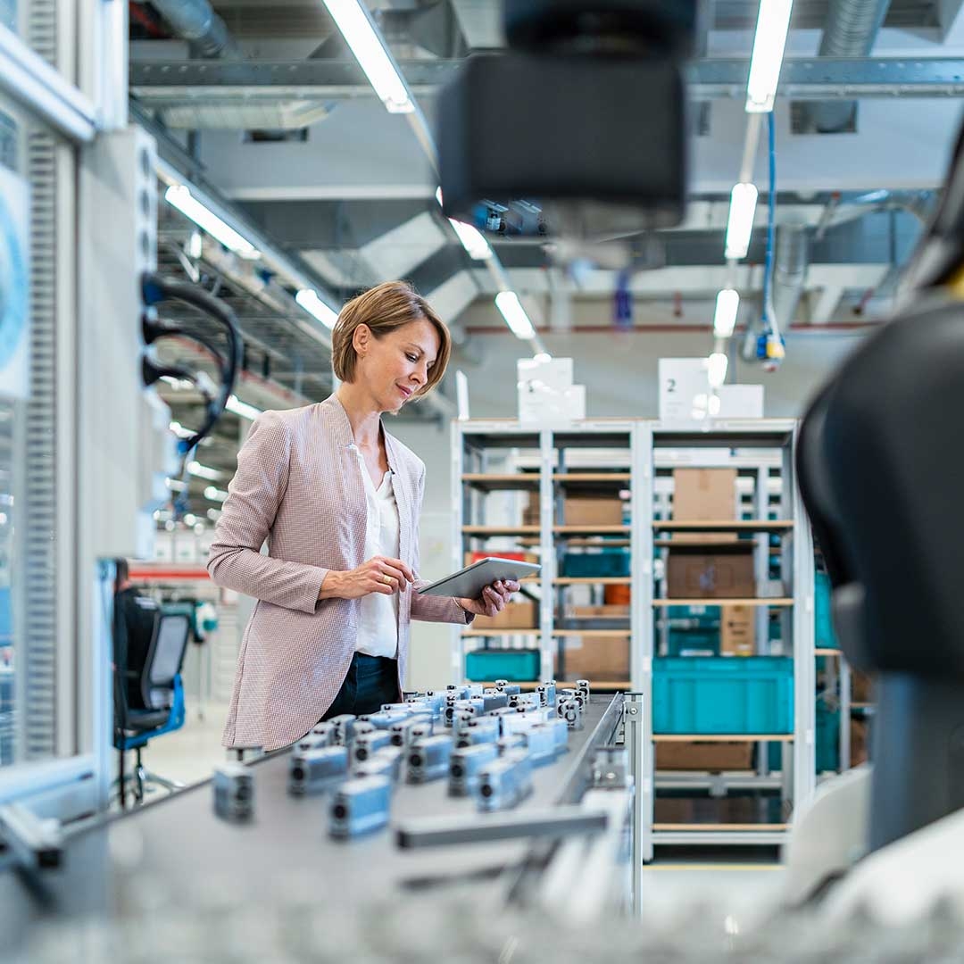 Businesswoman inside a factory