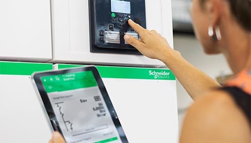 A person using a tablet to press a button