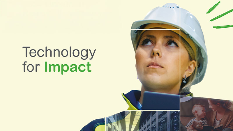 A person wearing a hard hat and a computer