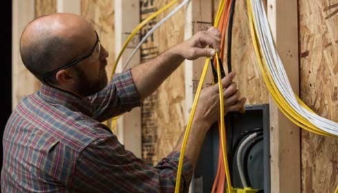 Contractor preparing to strip wires