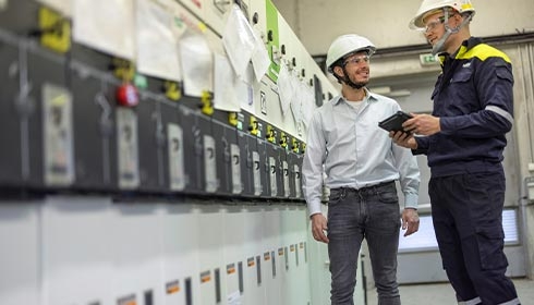 member of service team reviewing the performance of upgraded assets