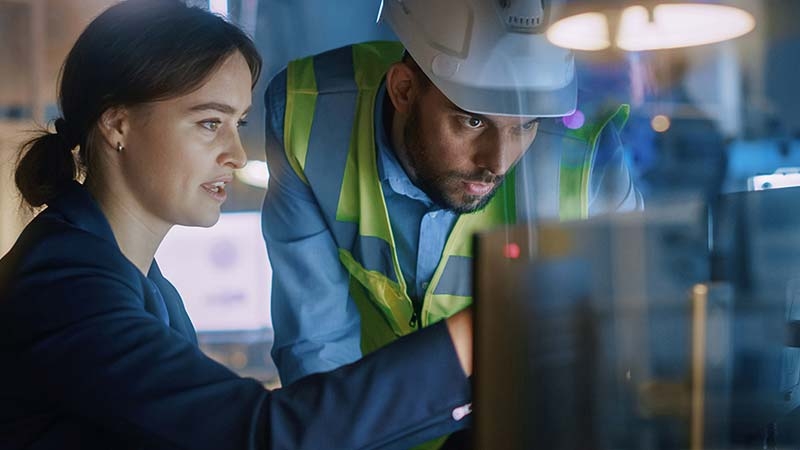man and woman with computer