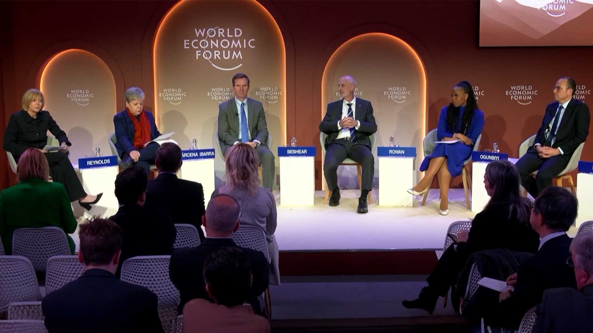 A group of people sitting on a stage