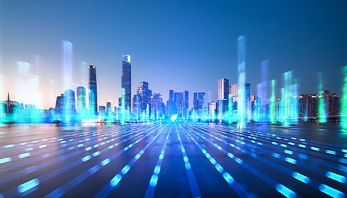 A city skyline with blue lights