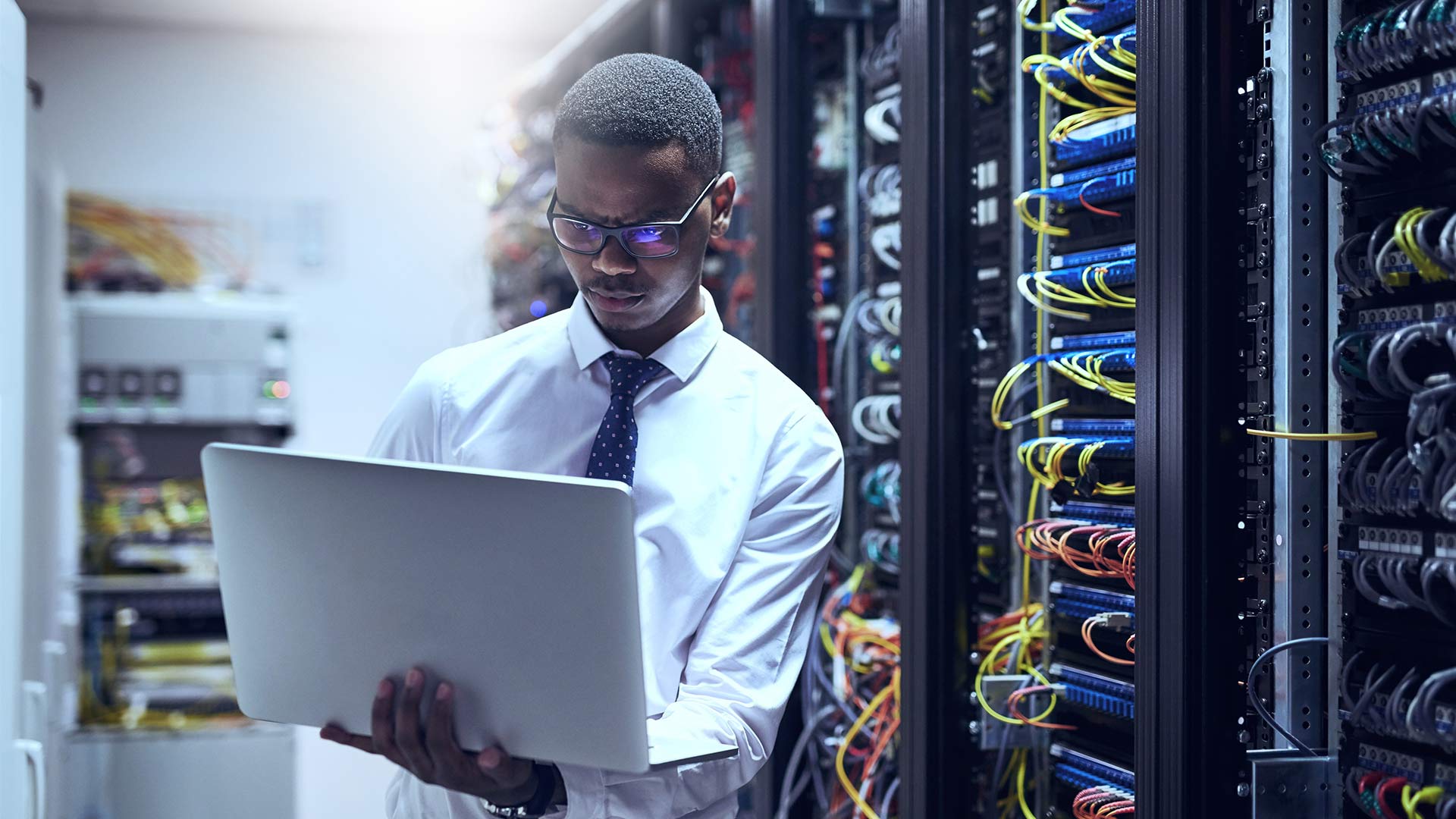 IT technician working on his laptop