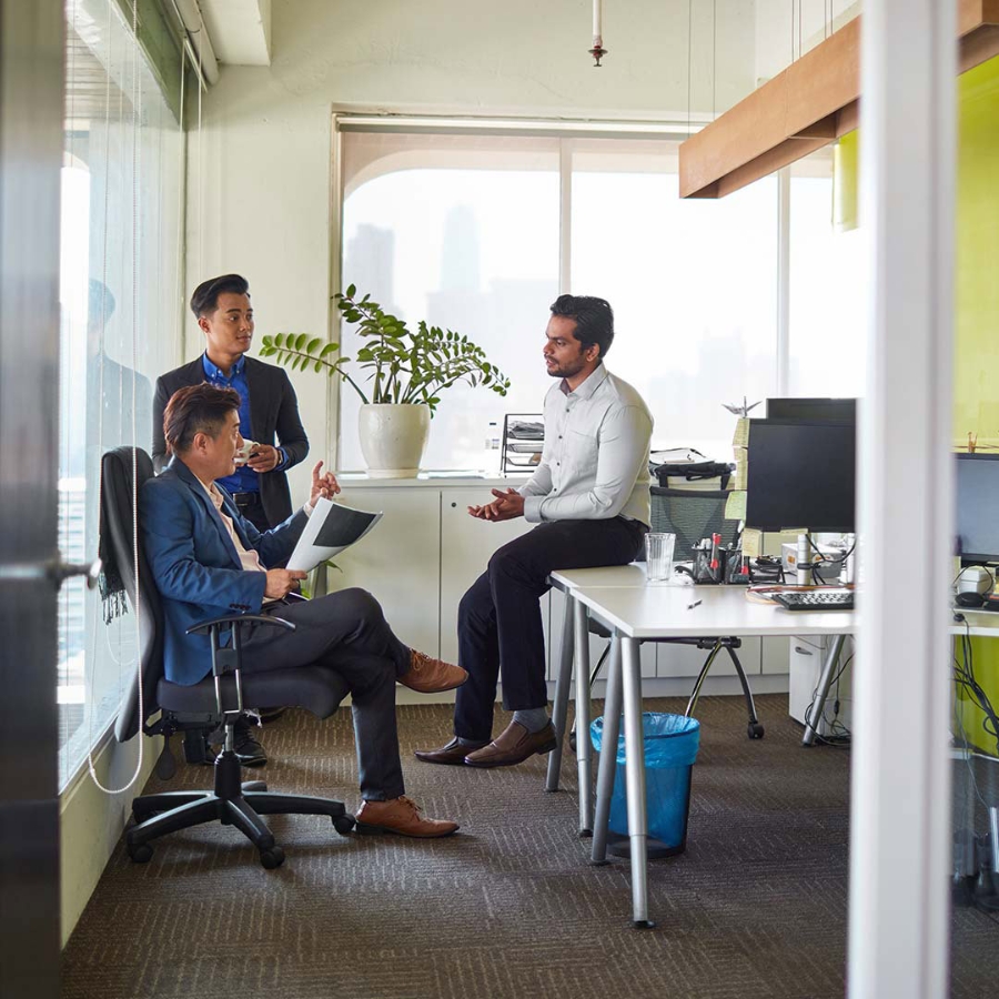 Employees discussing at office