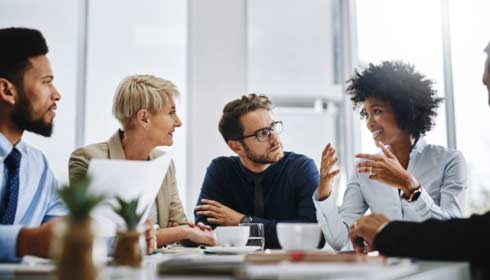 Shot of a group of businesspeople sitting together in a meeting