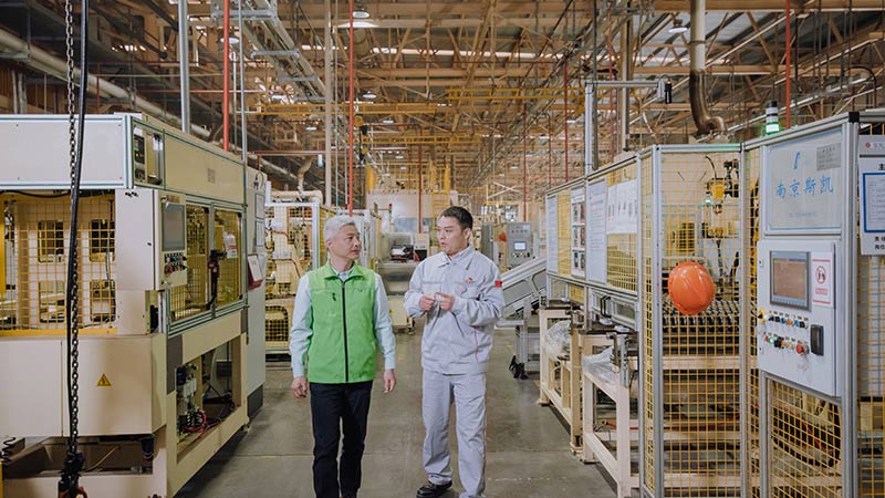 Technical workers discussing in the equipment room
