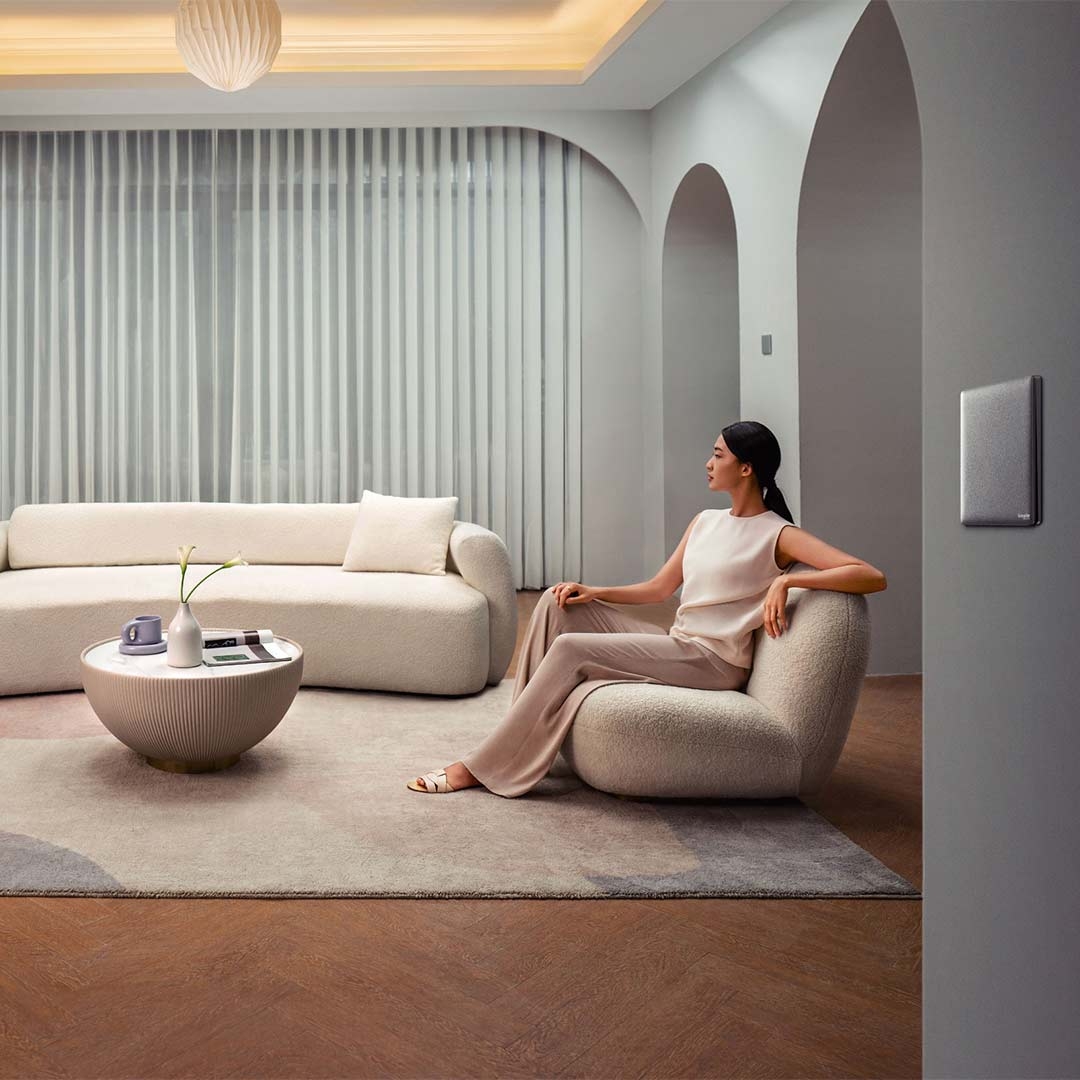 Lady in the living room sitting on couch