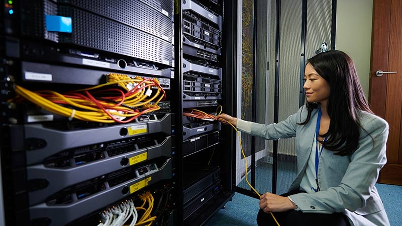A woman in the computer room