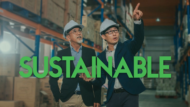 Two people communicating in the factory building