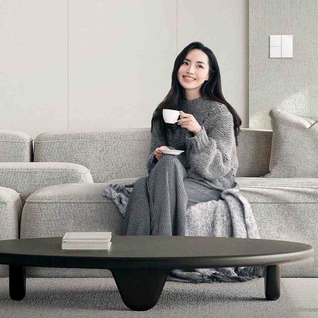 A woman holding a cup