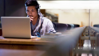 A man Searching something in laptop