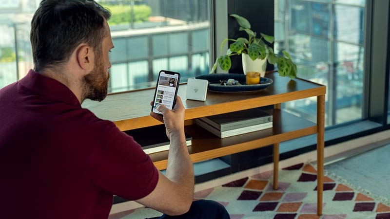 A man using his phone at home