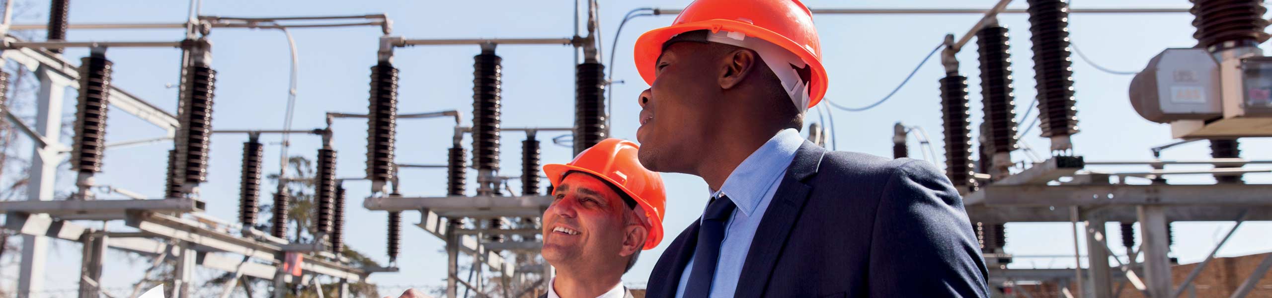 Two men discussing electrical infrastructure plans