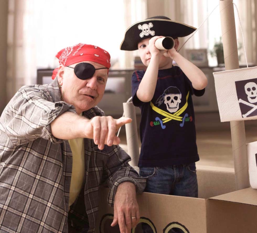 Grandfather and grandson playing pirates