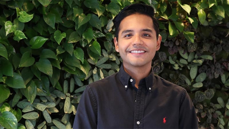 A man wearing black shirt smiling