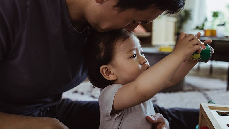 A father playing with his kid