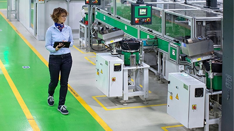 A person standing in a factory