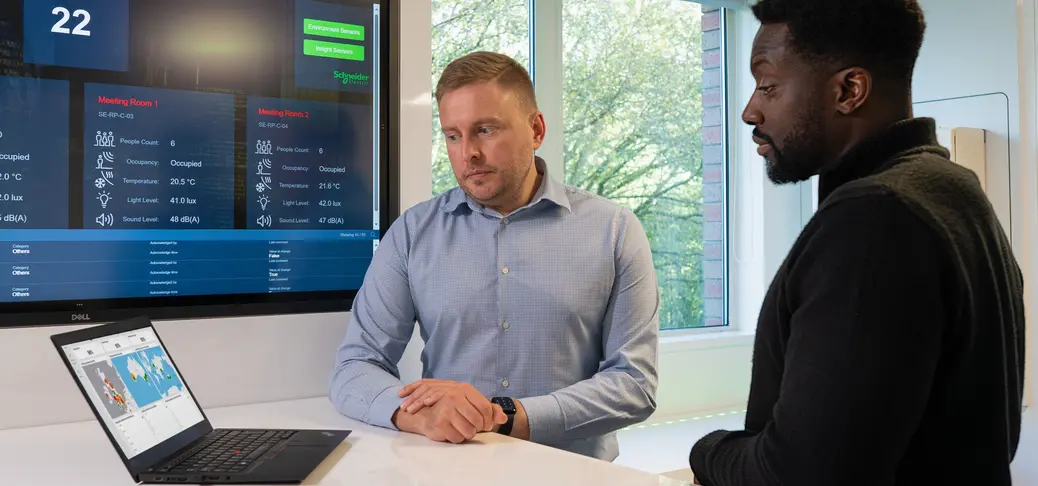 Two man looking at laptop screen