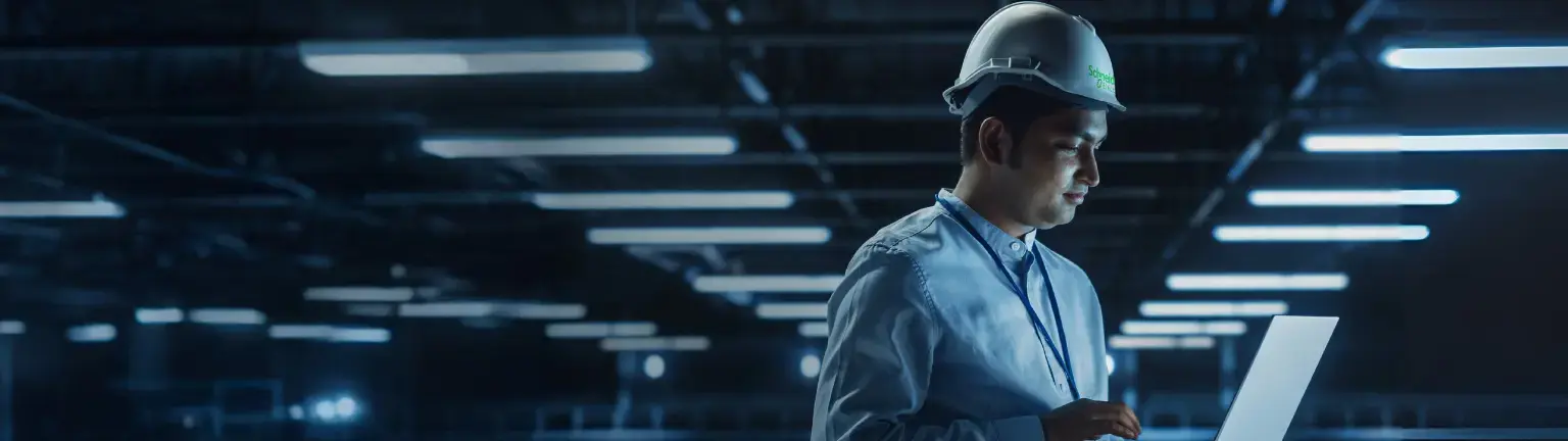 Two engineers working on a tablet