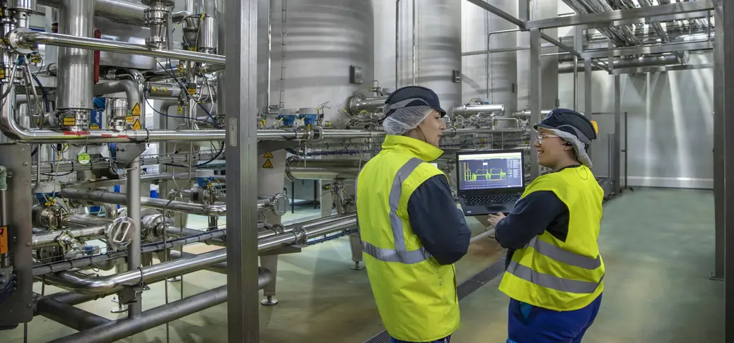 Two engineers in a factory