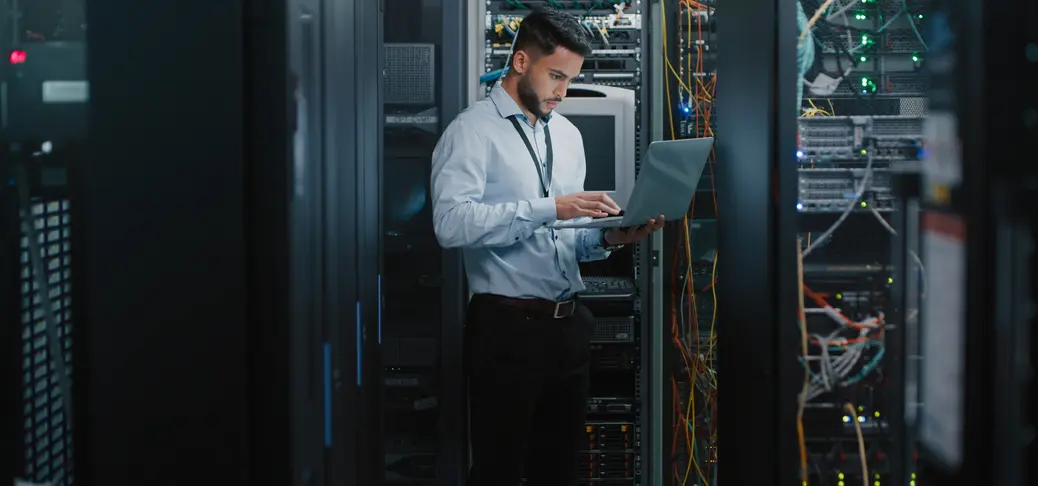 Evlink specialist looking at a tablet and conducting maintenance service.