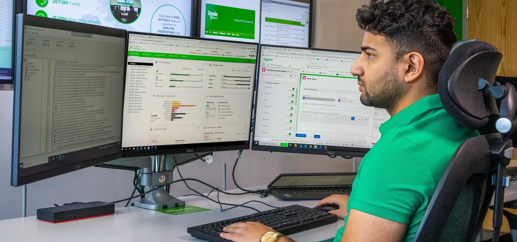 Asset management man with computer screens