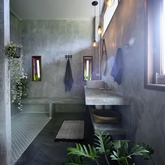 A bathroom with a sink and a shower