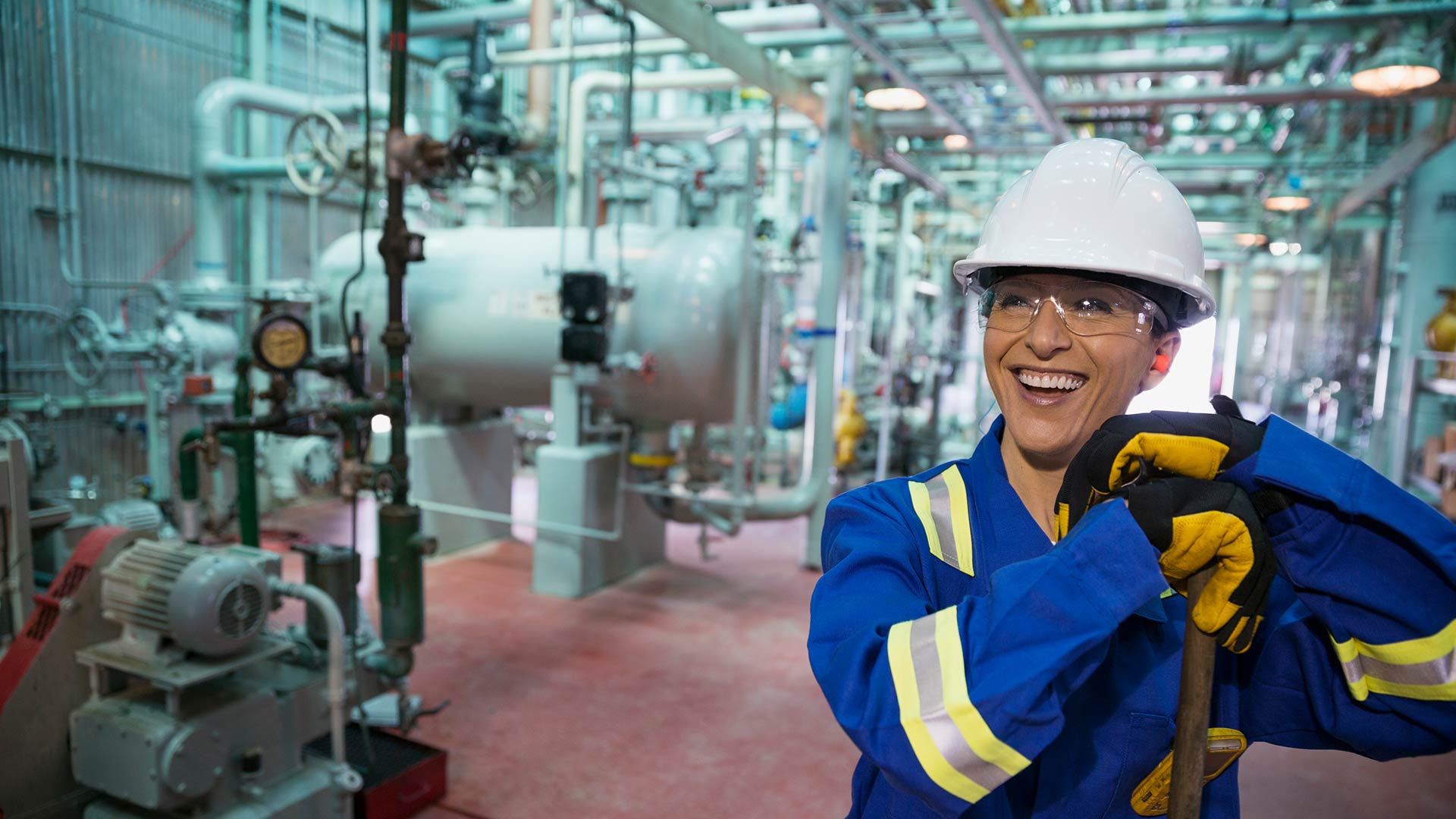 Female worker smiling in gas plant