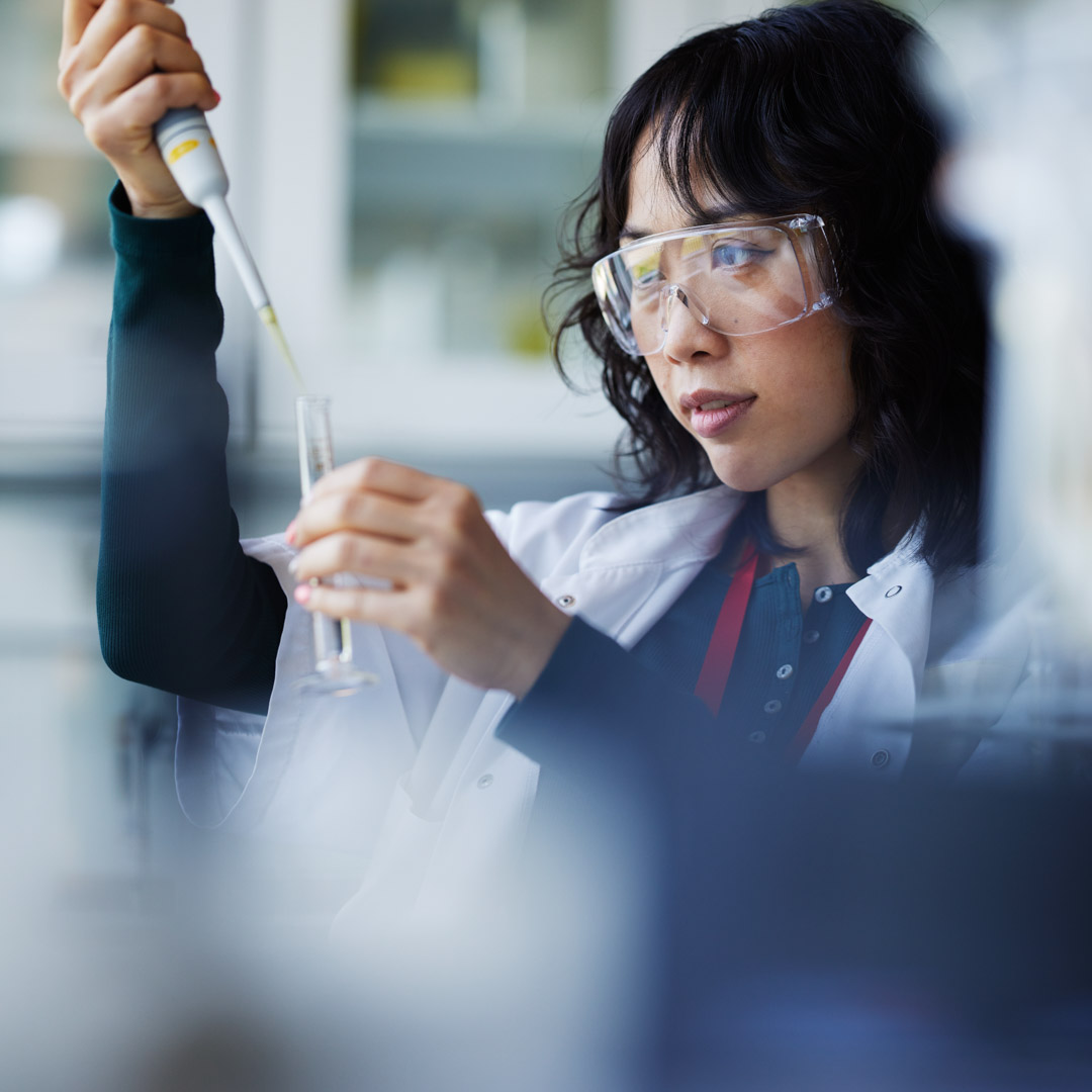 Female field scientist looking at sample