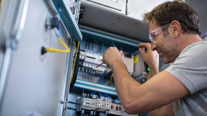 A person working on a machine