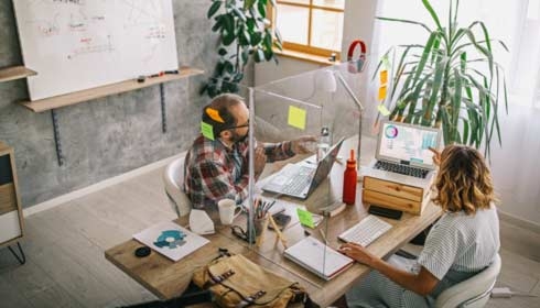 a mother and her daughter at home reading a book