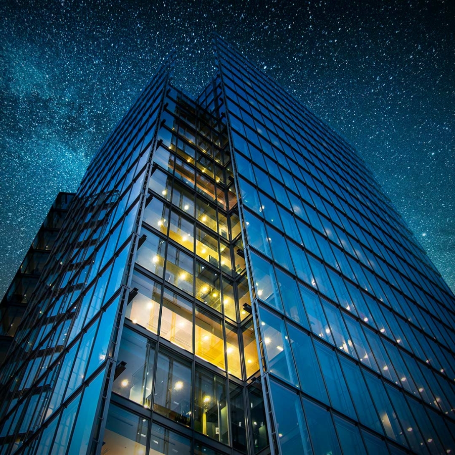 view of a tall building at night