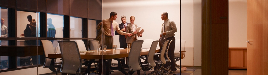 Four businesspeople in boardroom