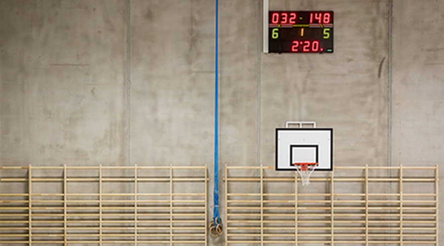 Scoreboard clock mounted in a gymnasium